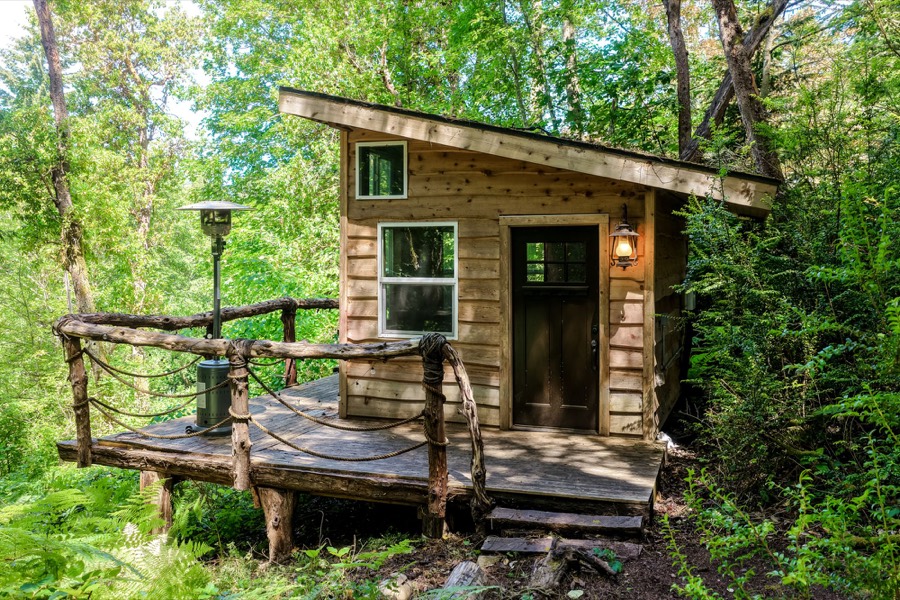 Cedar cabin exterior at 131st Street Acreage